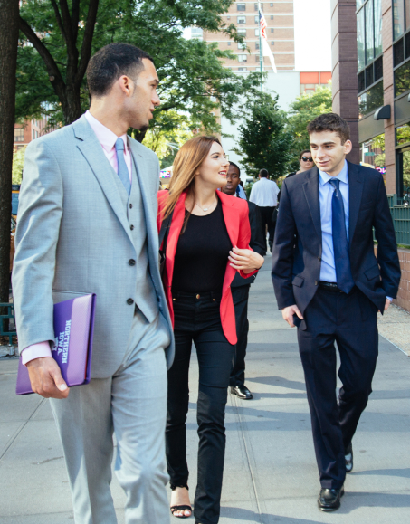 Libra Group Interns having a conversation while walking down the street