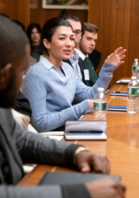 Libra Group executive at meeting table